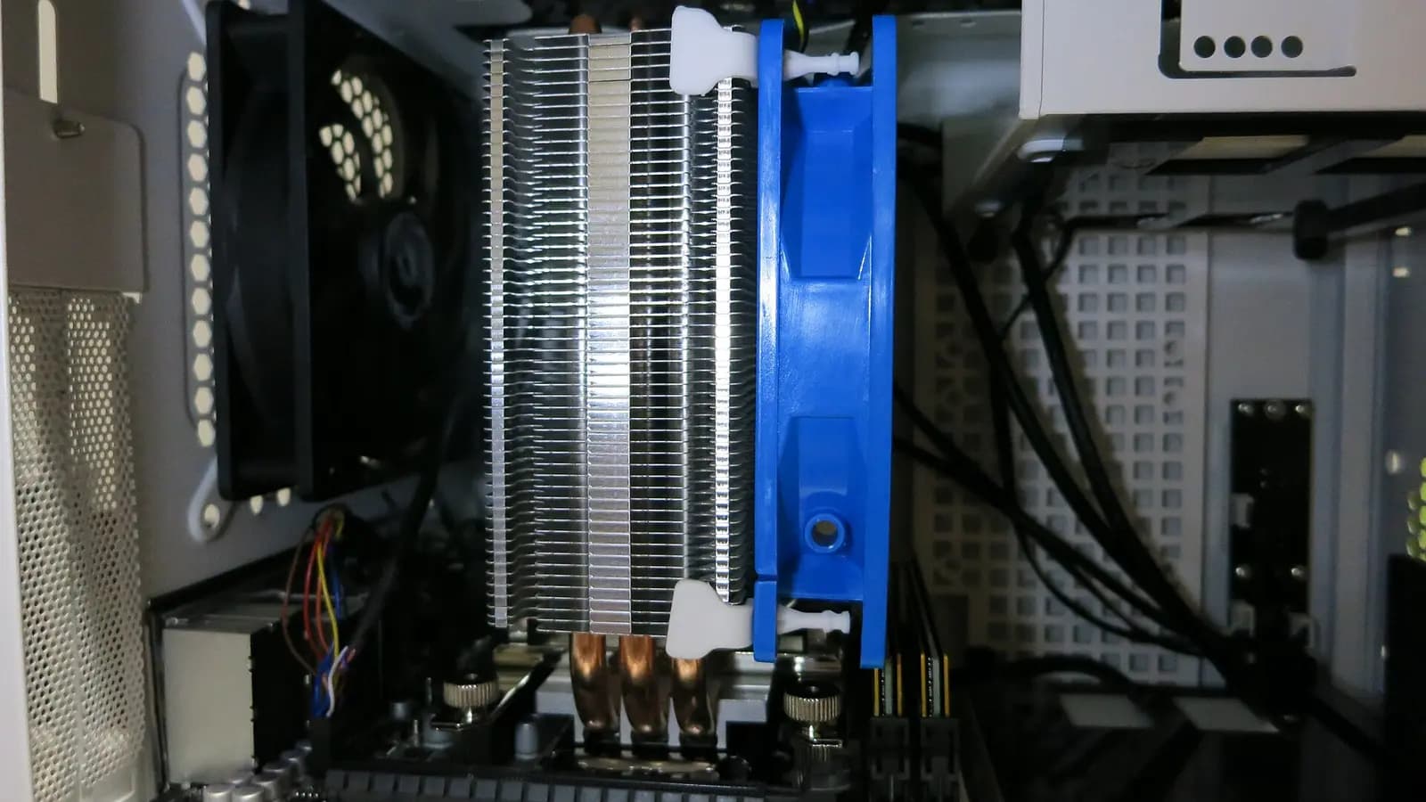 A thin laptop with a glowing processor die floating above its keyboard
