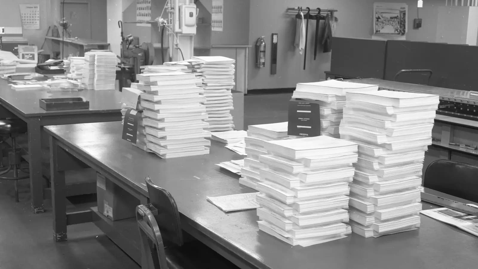 Stacks of documents feeding through a lens into structured fields, one field highlighted in red