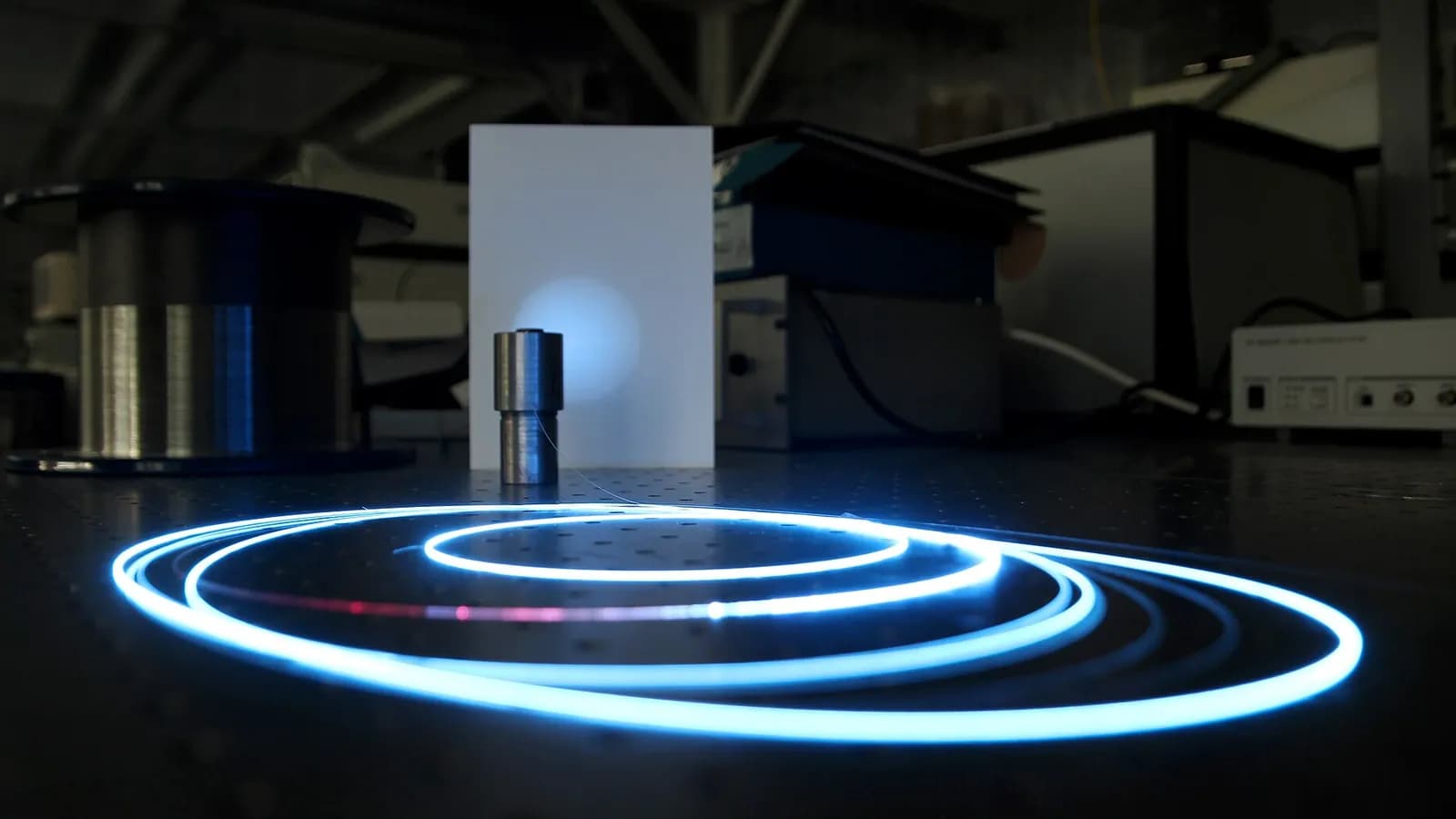 Several separate machines linked by glowing cables into one controlled hub