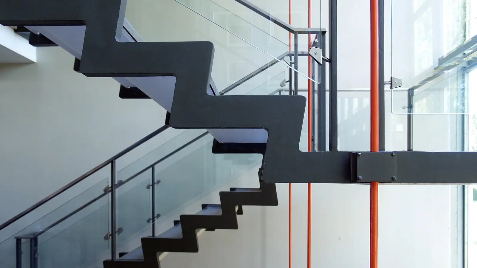 A descending staircase of glowing steps with the lowest step lit red